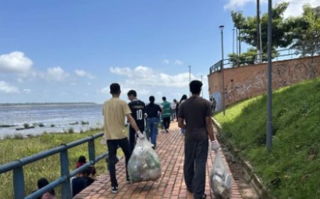 ESTUDANTES LIMPAM ORLA DE BELÉM E ERGUEM BANDEIRA PELO CLIMA
